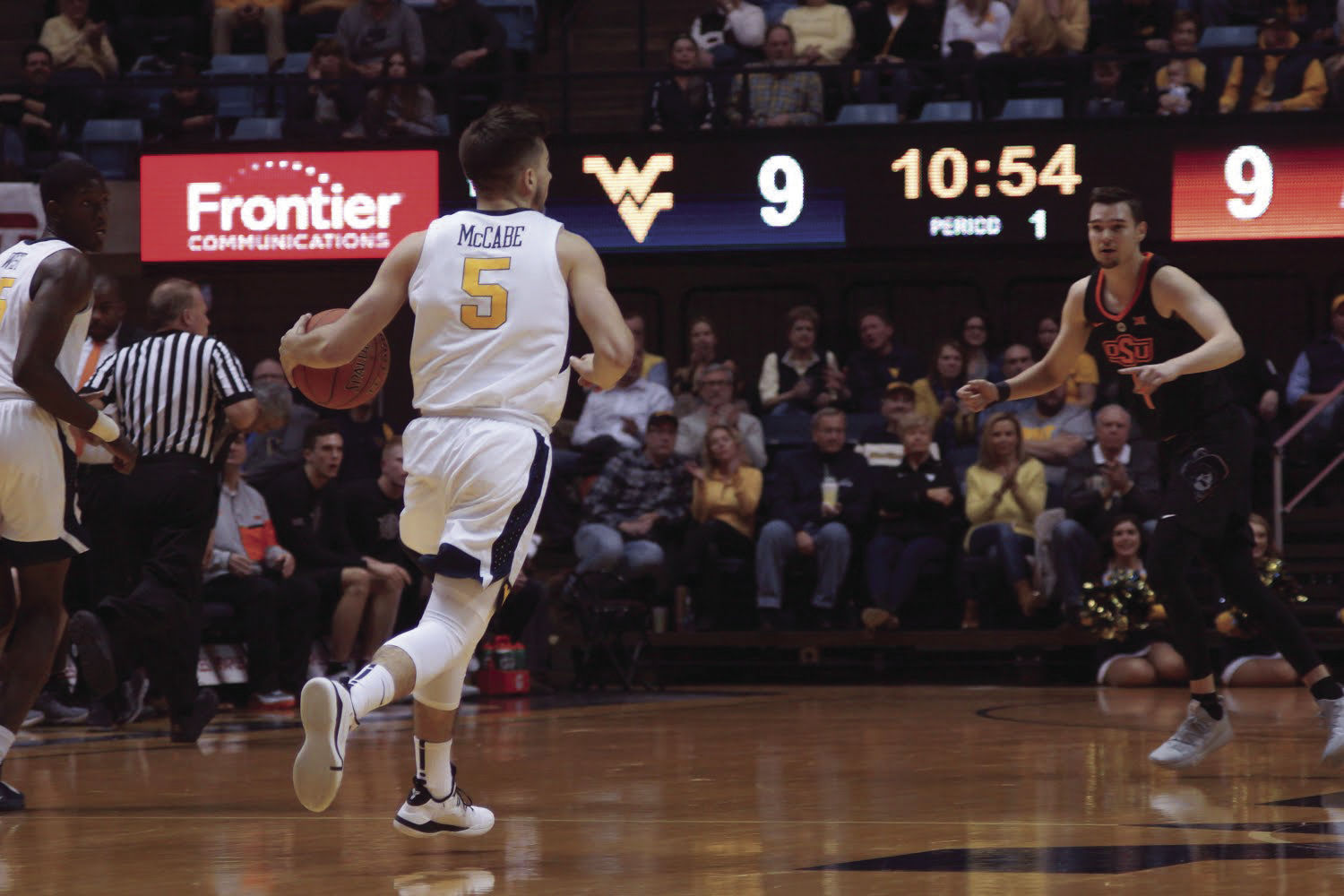 Guard Jordan McCabe making his way down the court scanning for open players
